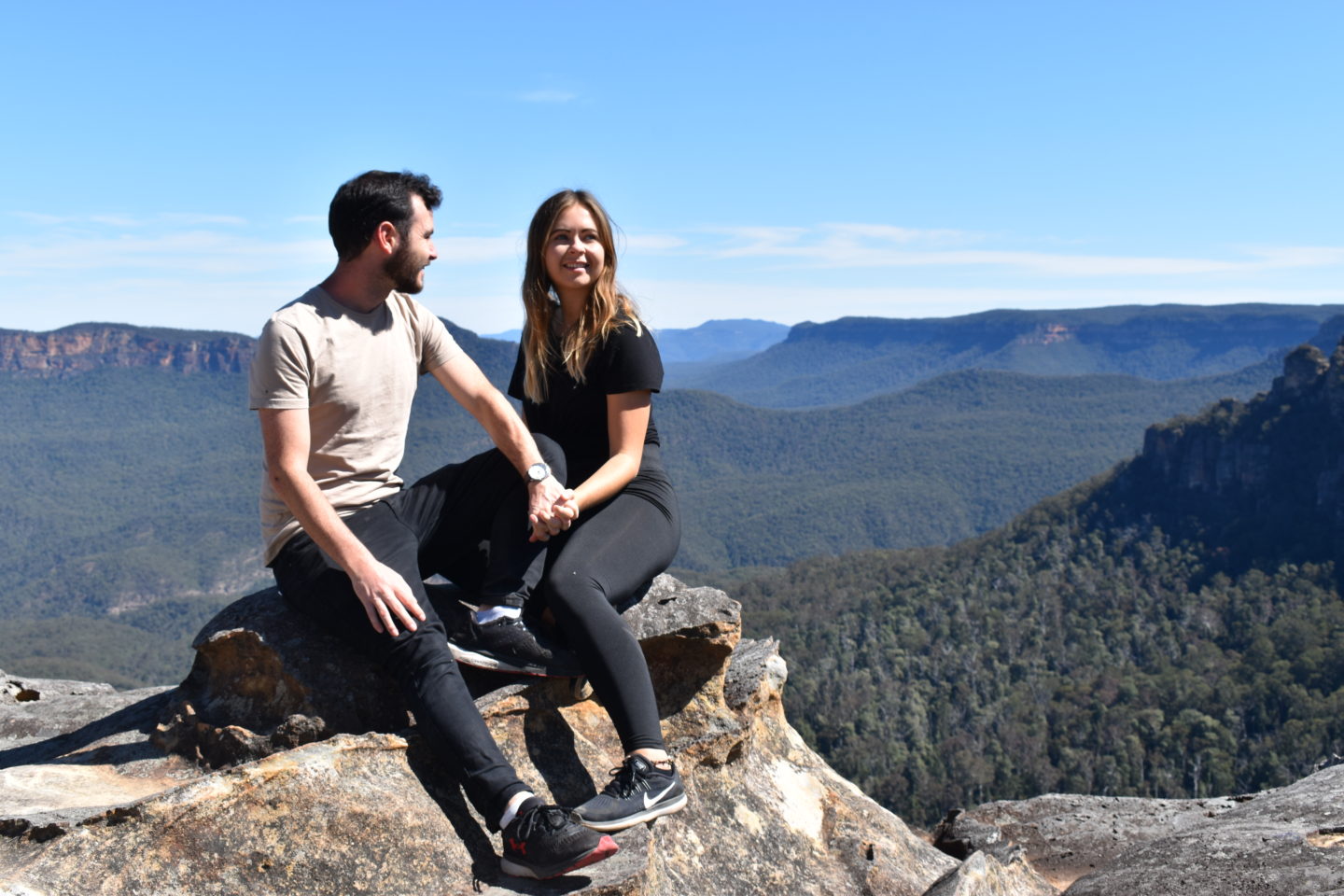 A couple sat looking a the view of The Blue Mountains, Sydney,