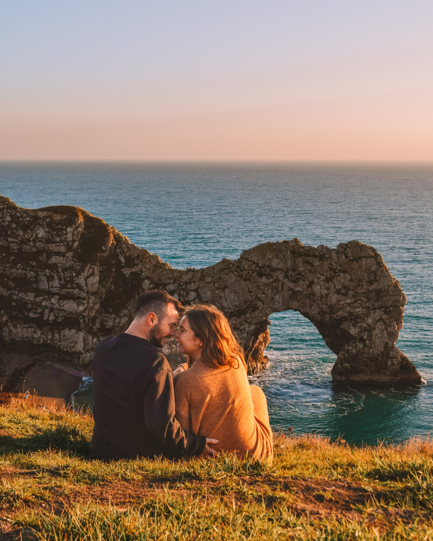 Places to visit in Dorset - Durdle Door at sunset