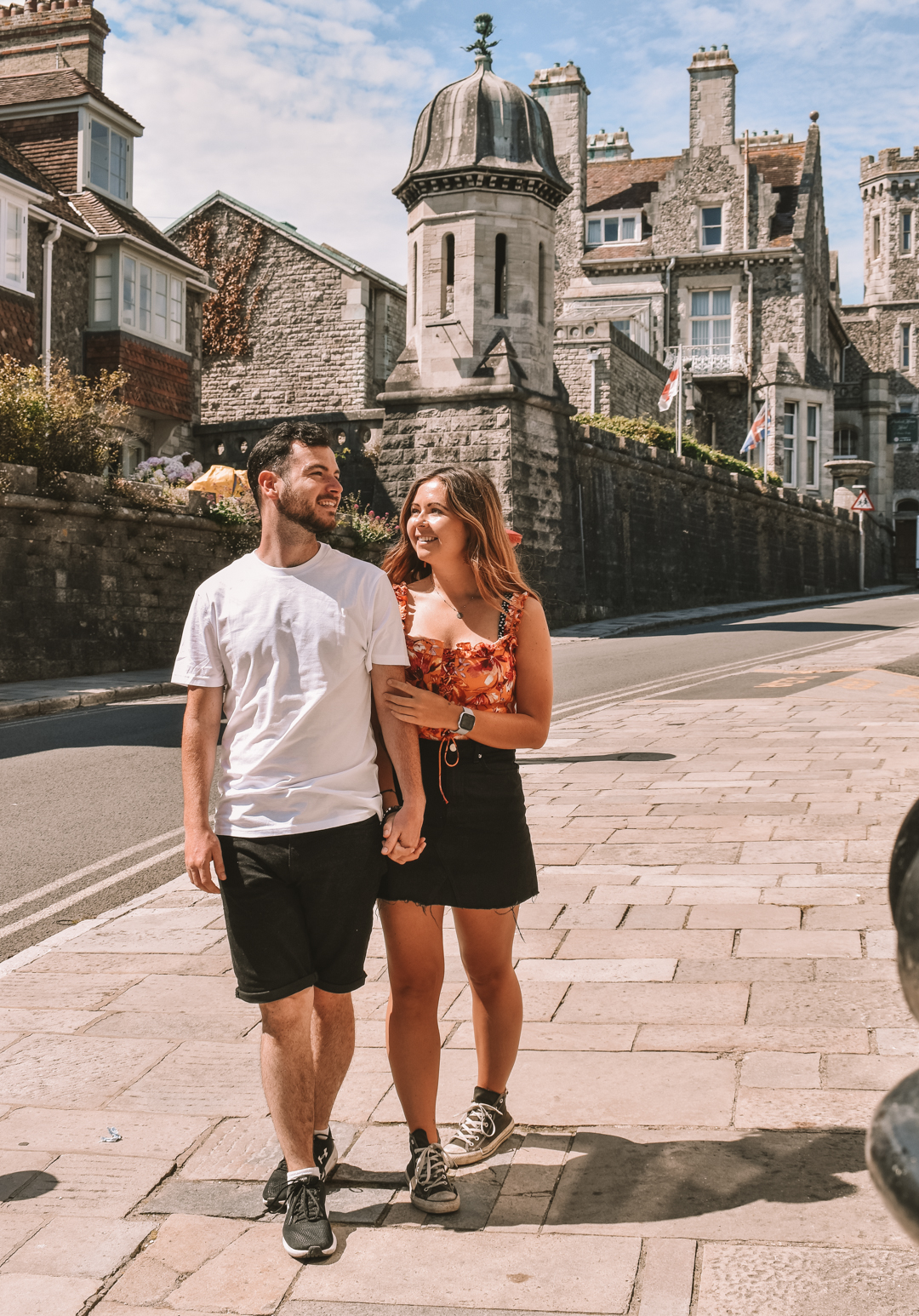Couple walking along the cobbled streets of Swanage