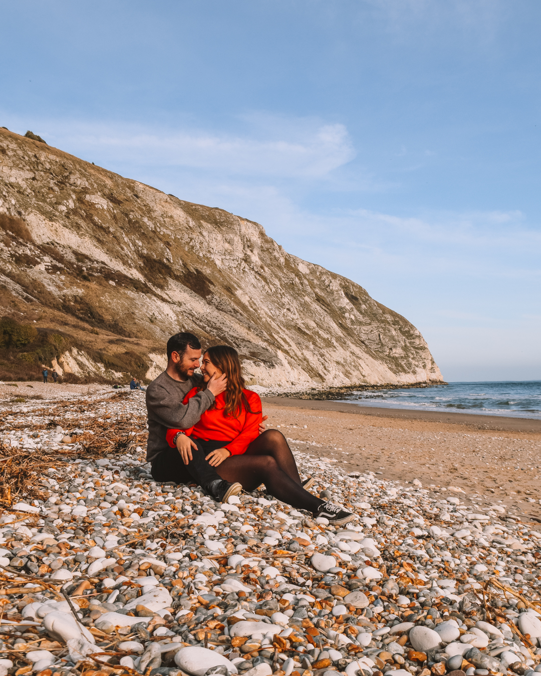 A couple sitting on Swanage beach