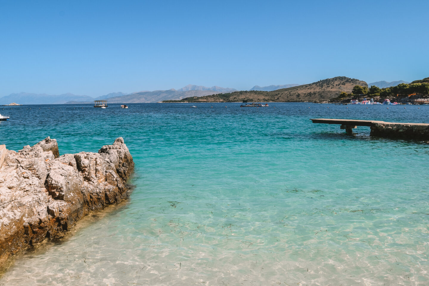 Beaches Ksamil to visit, clear blue water and blue skies