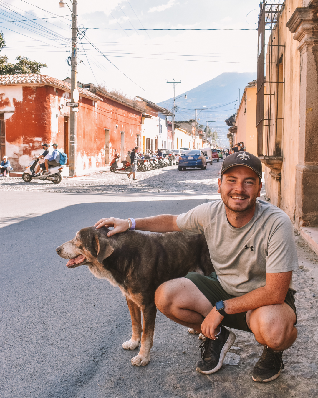 Chris with a dog on the streets of Antigua