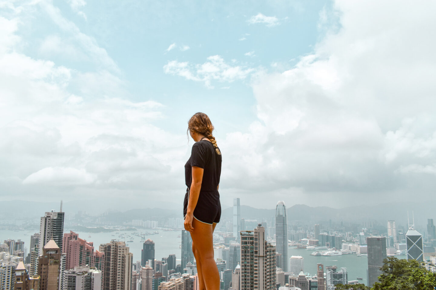 Girl looking at the view over Victoria Peak - Unique 3 day itinerary for Hong Kong in 2024