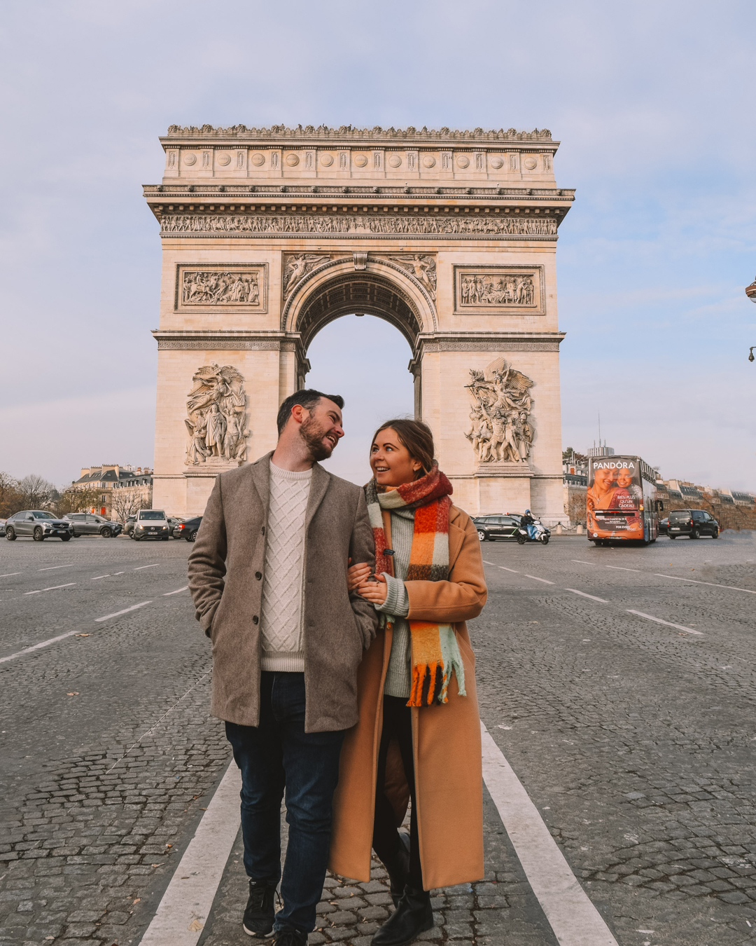 Chris and Reanna walking in front of the Arc de Triomphe