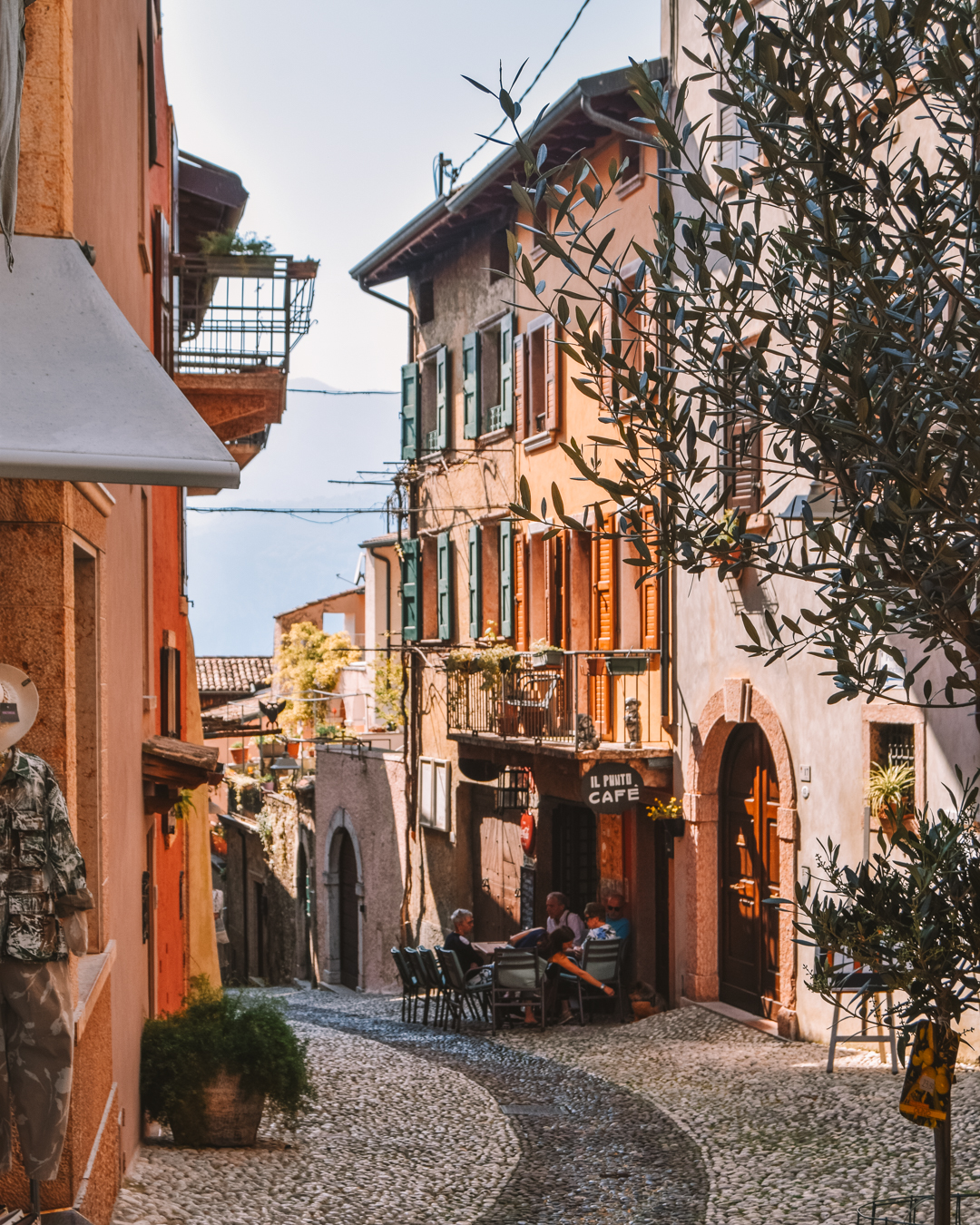 A winding street with cute buildings on it in Malcesine
