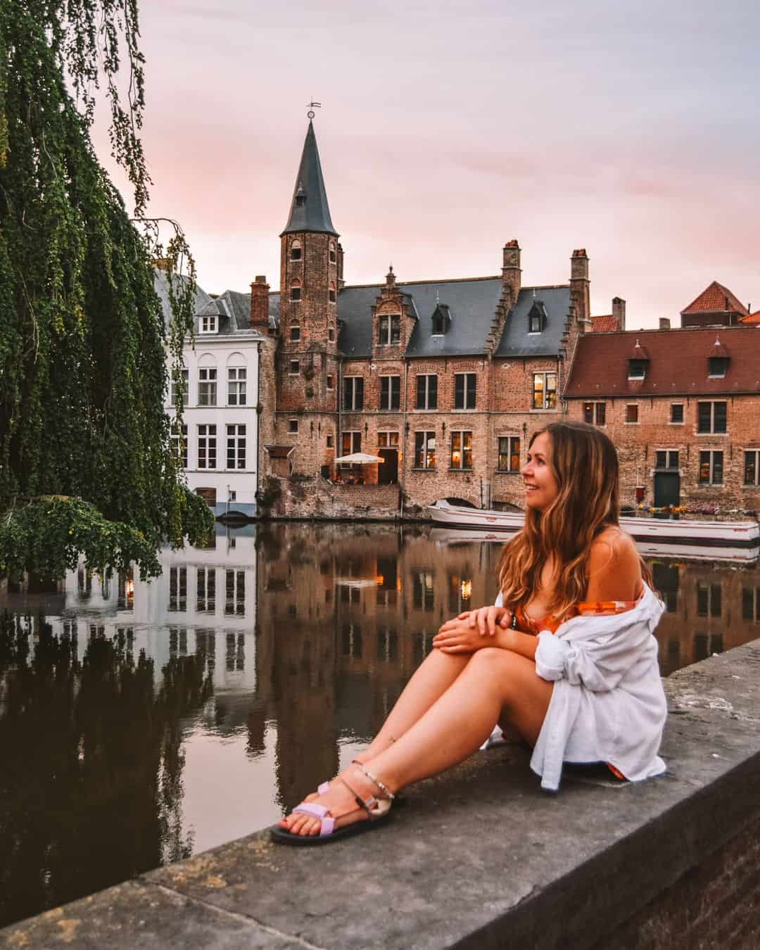 Reanna at sunset in Brugge overlooking the water