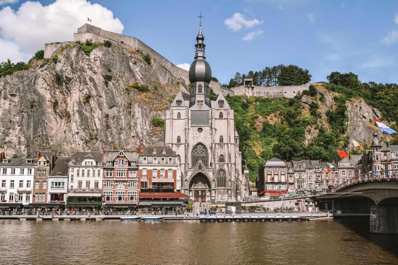 The river in front of the gothic church in Dinant