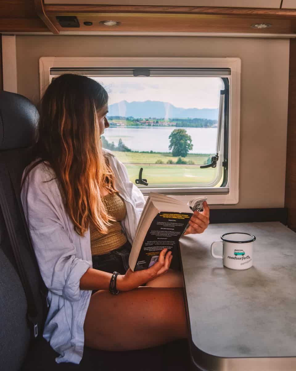 Reanna reading in the Roadsurfer campervan