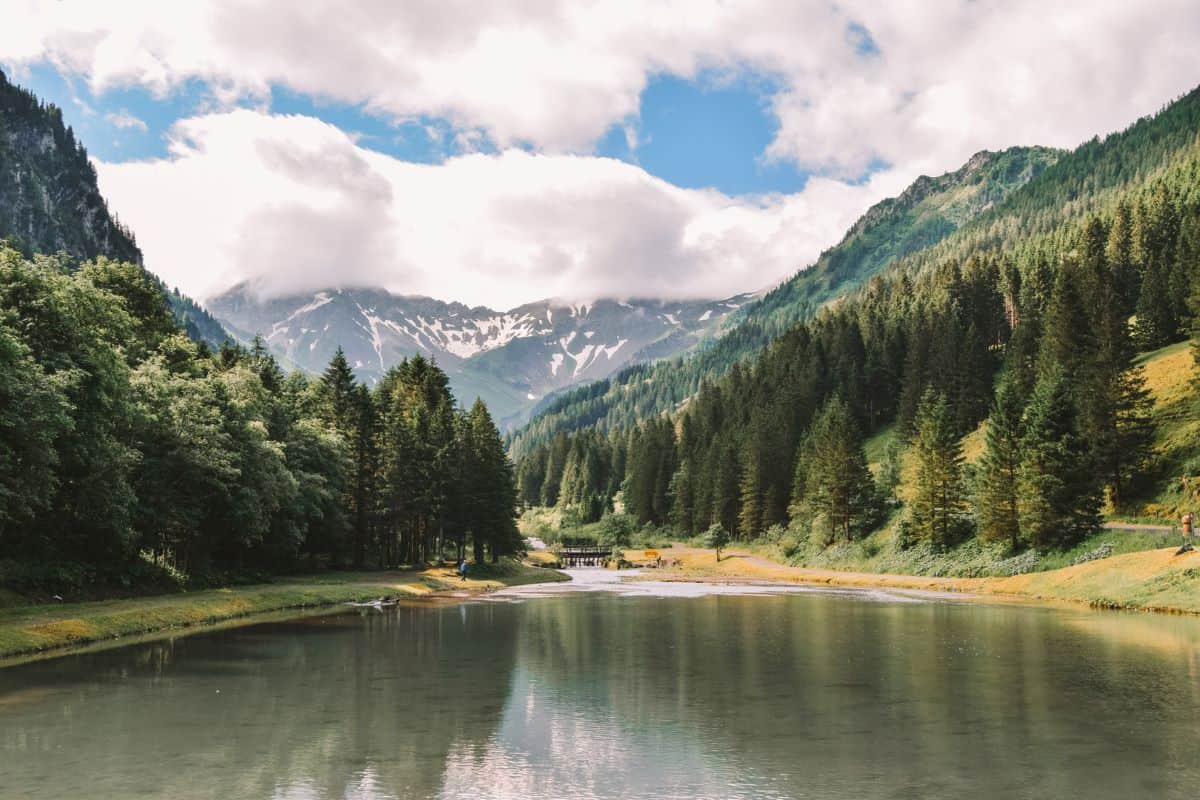 Gänglesee, a lake in Liechtenstein with a lake in the forefront and mountain in the background