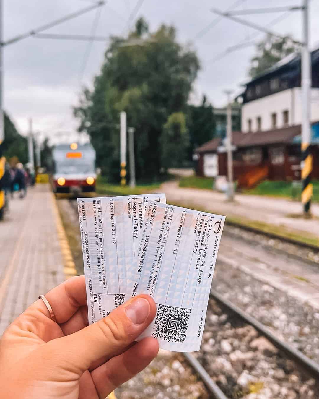 Tickets with a train behind in the Tatras Mountains