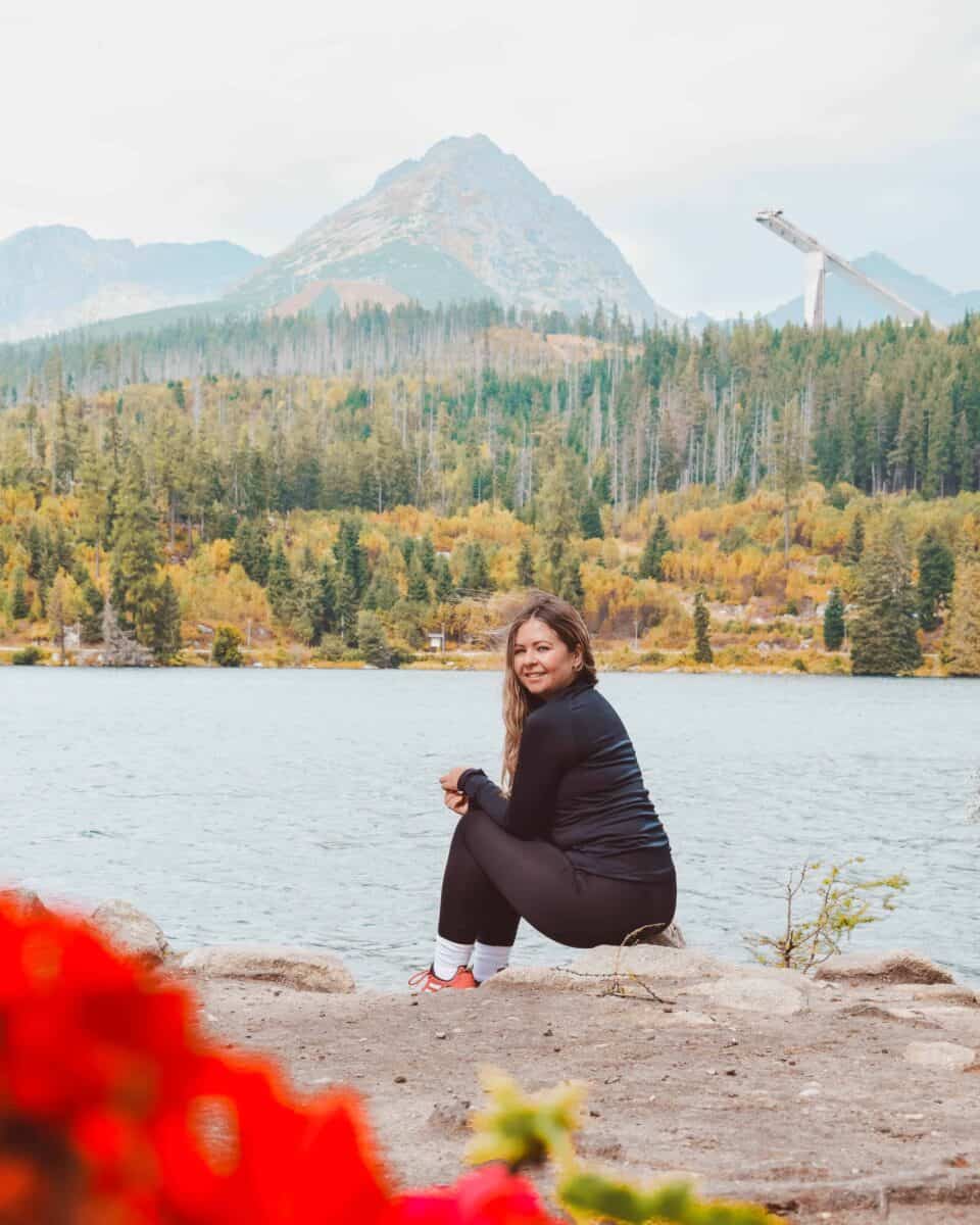 Reanna sat on a rock at Štrbské Pleso 